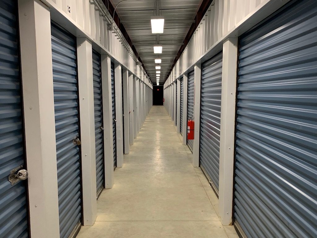 Hallway of indoor storage unit doors.