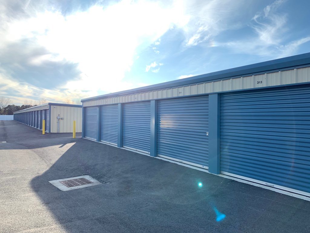 Closed doors on a row of large storage units.